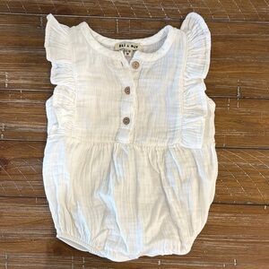 Boutique brand Eli and Nev White Ruffled Baby Romper